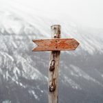 arrow sign on mountain